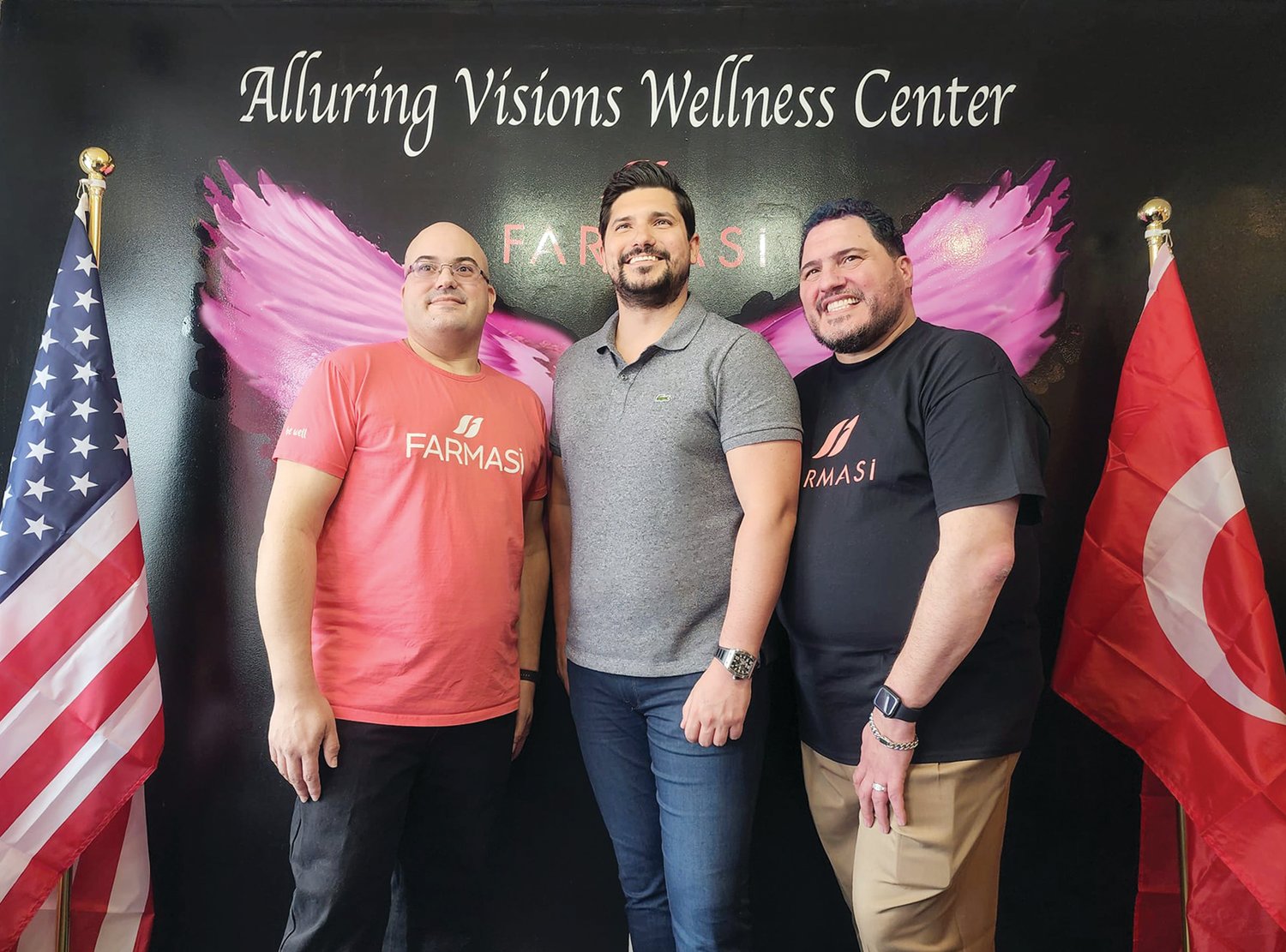 Meet Wayne (l) & Michael Medeiros (r), the owners of Alluring Visions Wellness Center, the only retail store in the USA which sells the internationally-known FARMASI products.  They are seen here flanking the grandson of FARMASI’s founder, Emre Tuna.